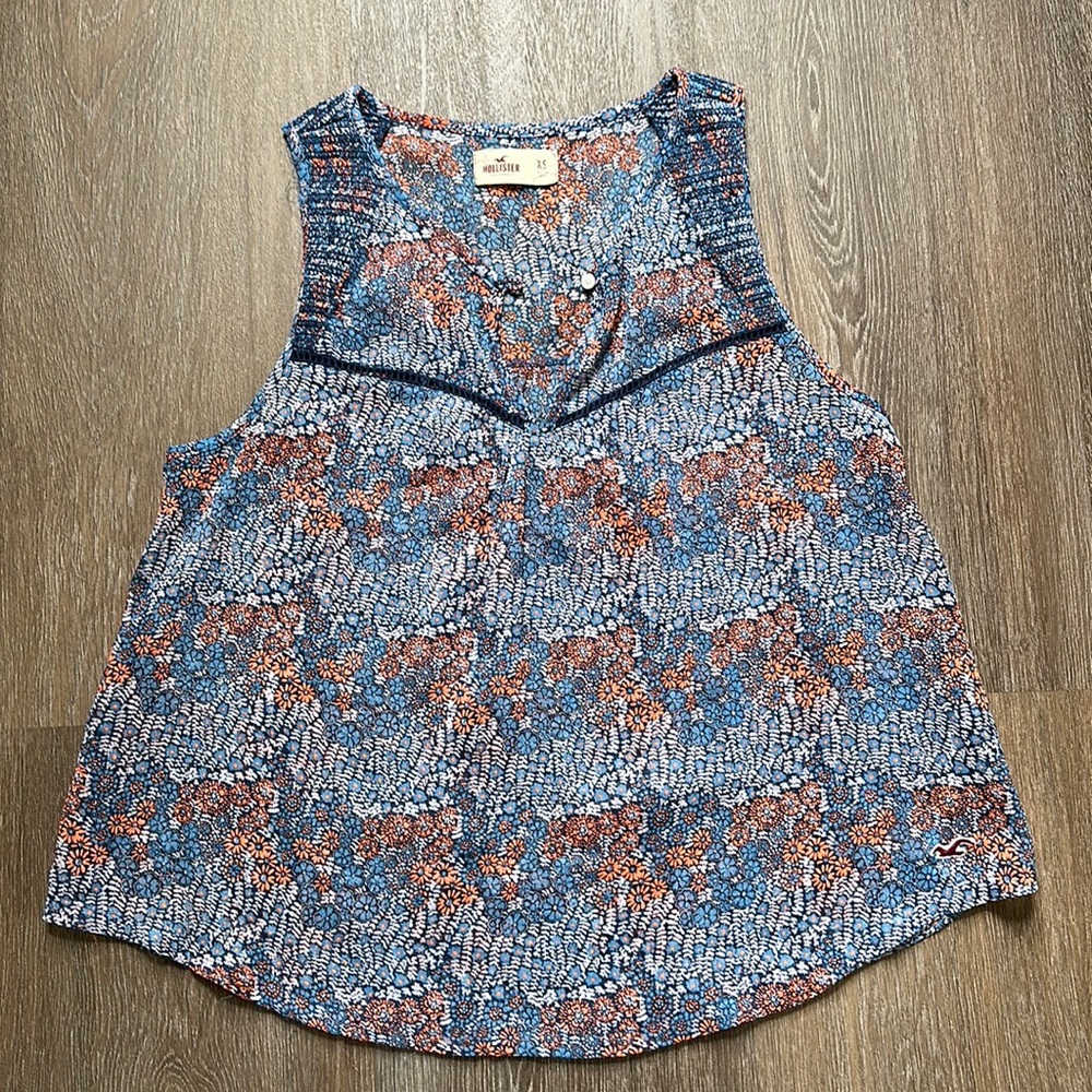 Sheer floral sleeveless blouse